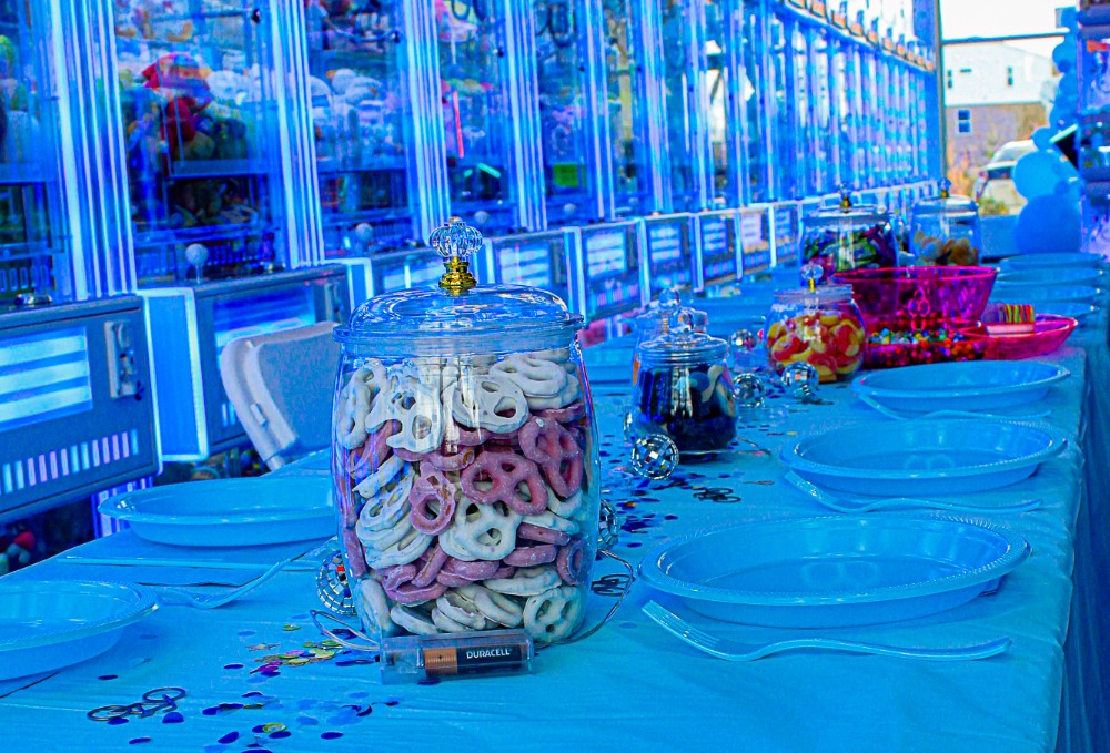 Pretzels and candy jars on the party table