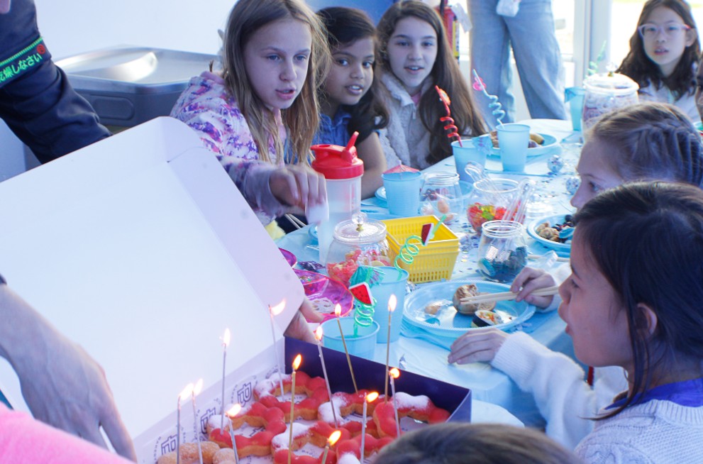 Cake reveal with the birthday crew