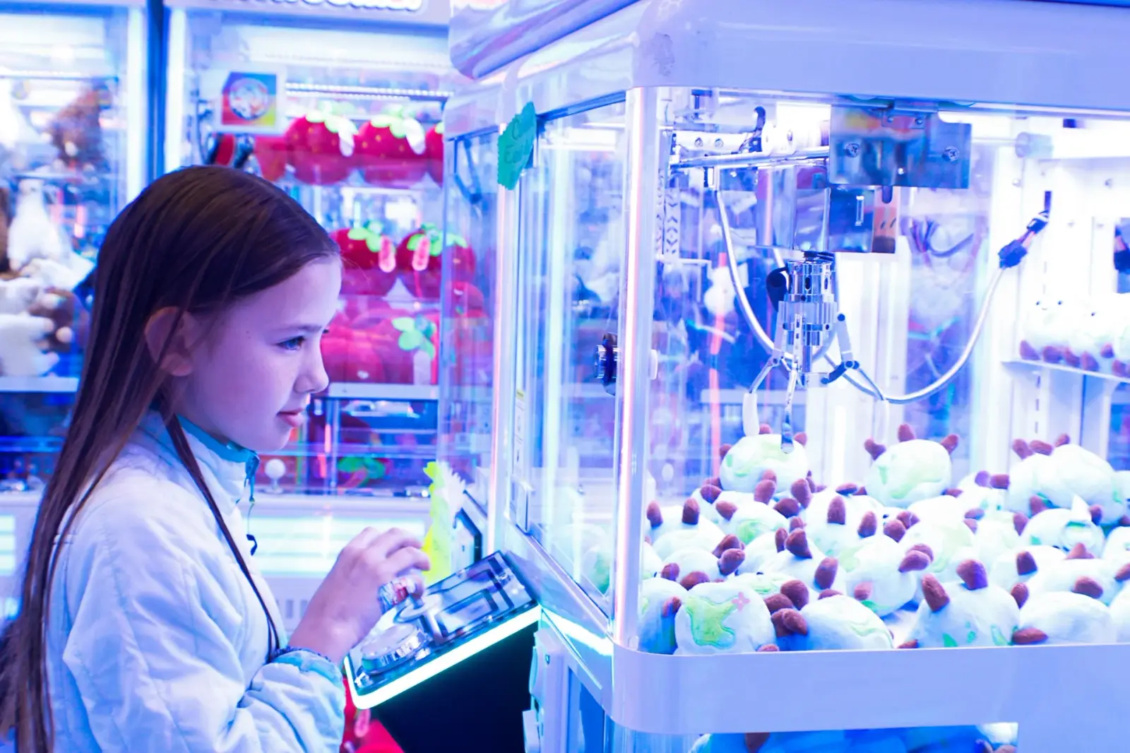 A row of colorful Klawsome claw machines ready for an event