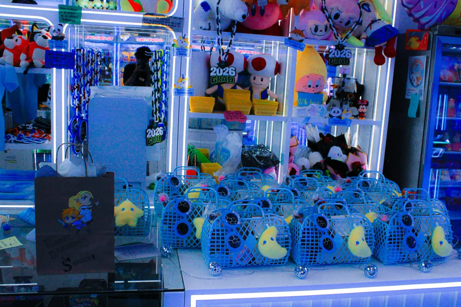 Adult and child playing a claw machine together