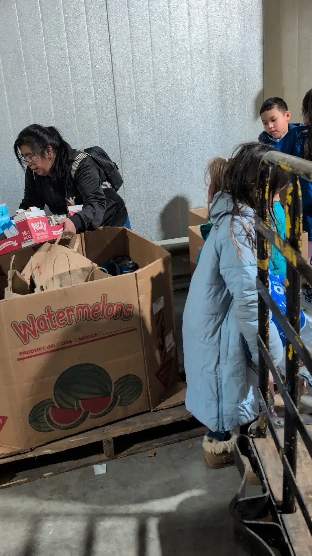 Sorting boxes of canned goods at the warehouse