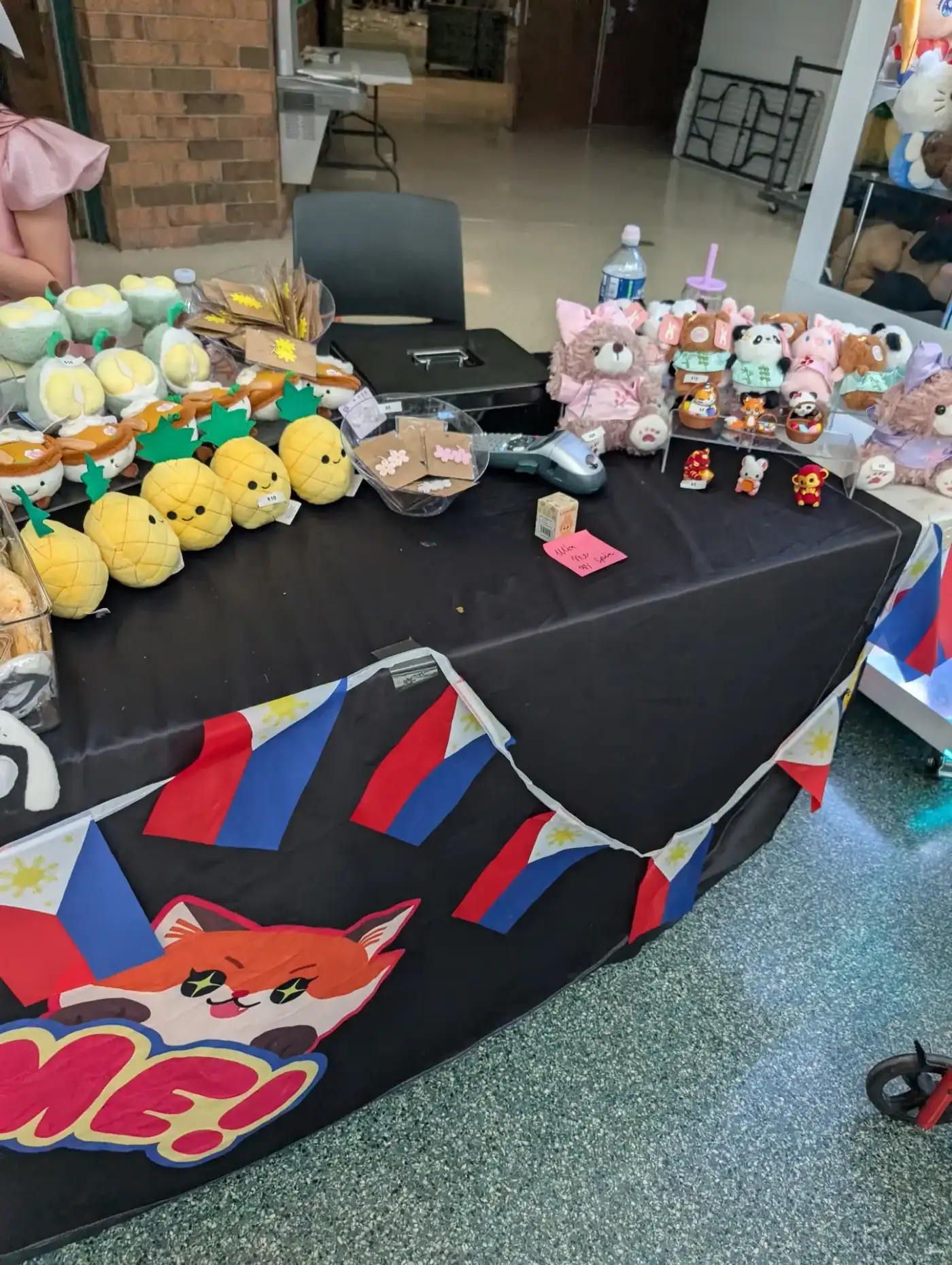 Paaralang Pilipino event table with plushies and gifts
